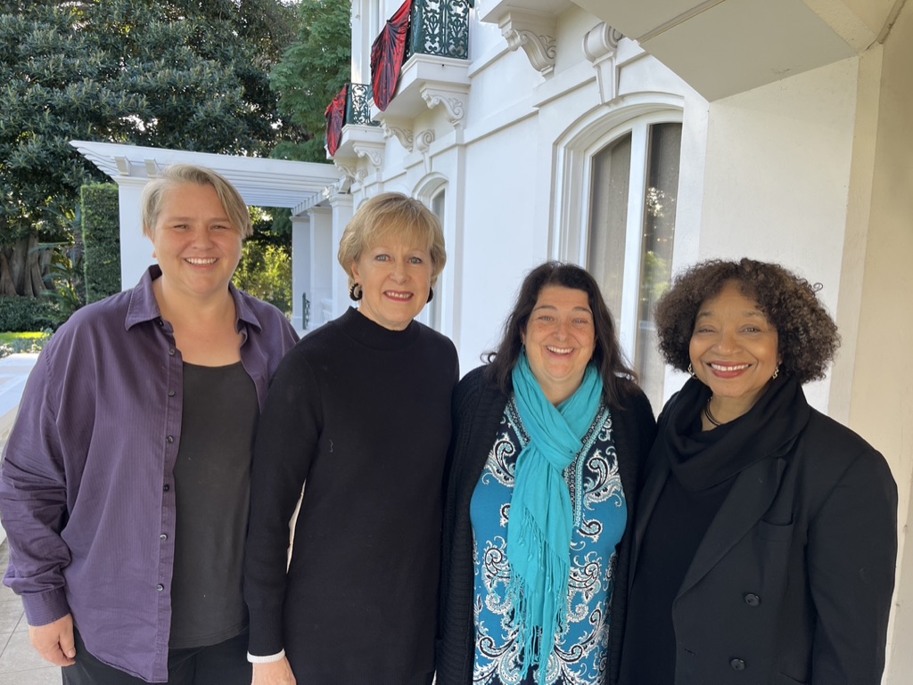 Pasadena Executive Roundtable Steering committee standing outside of the Tournament of Roses House. From Left to Right is Kim Olpin, Cindy Bengston, Elizabeth Dever, and Jerri Price-Gaines